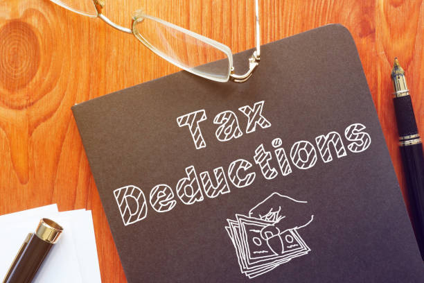 Tax Deductions Is Shown On The Conceptual Business Photo