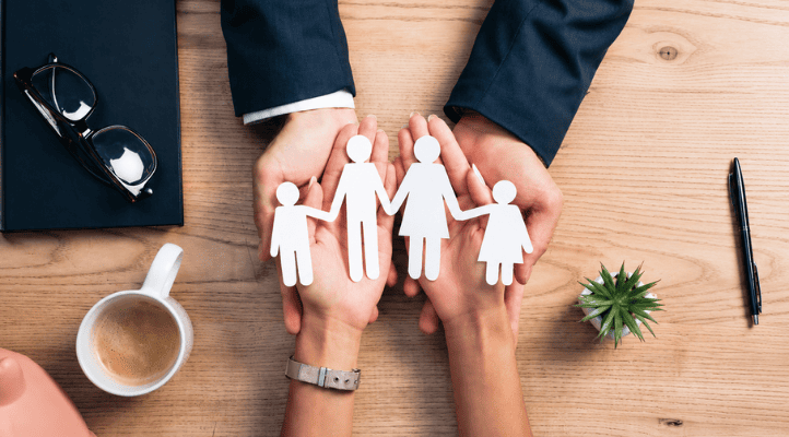 paper cutout chain of a family with legal experts to secure financial future